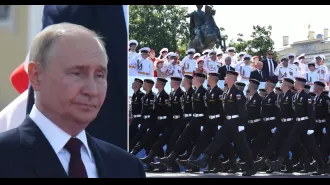 At Russia's Grand Naval Parade, Putin appears to be wishing he were somewhere else.