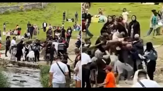 Hikers use sticks in altercation at well-known scenic location following disagreement.
