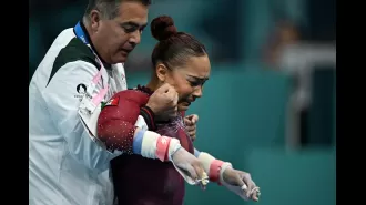 Injured gymnast perseveres through Olympic routine despite torn ligament, finishing in tears.