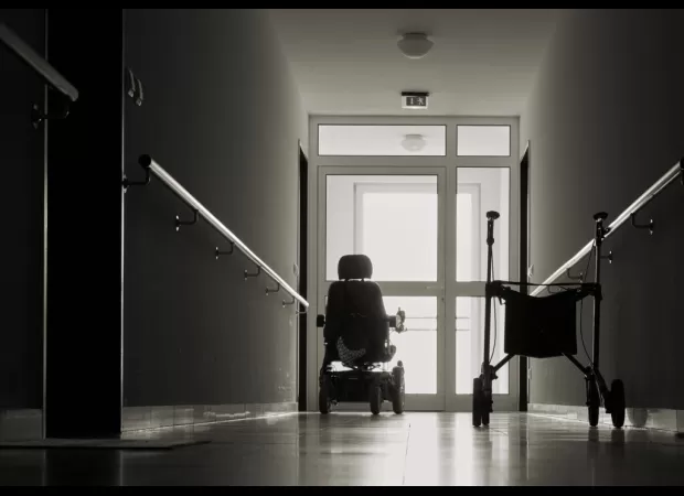 Video footage shows a home aide hitting an old woman with a saucepan.