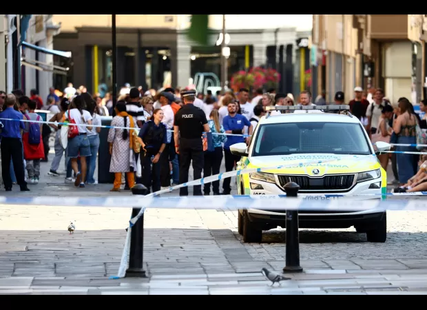 Two people in Bath hospitalized after a woman approached them with a bag.