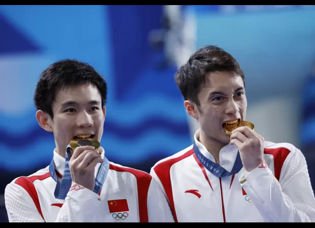 Chinese Olympians train 12 hours a day for 3 years without seeing their families.