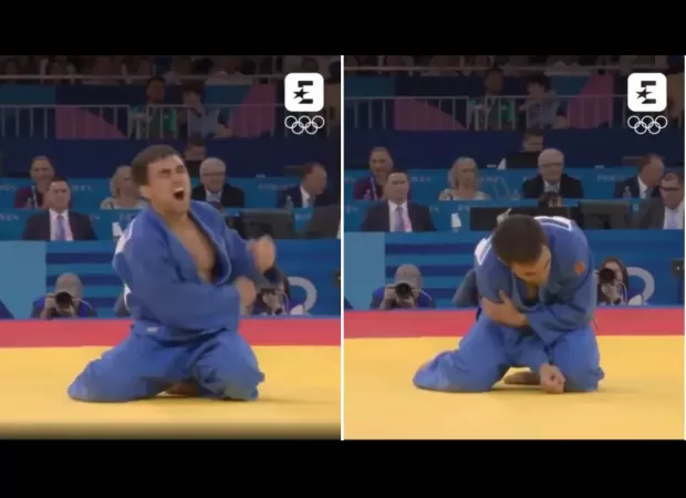 An Olympic athlete shouts in pain after sustaining a bizarre injury during their medal celebration.