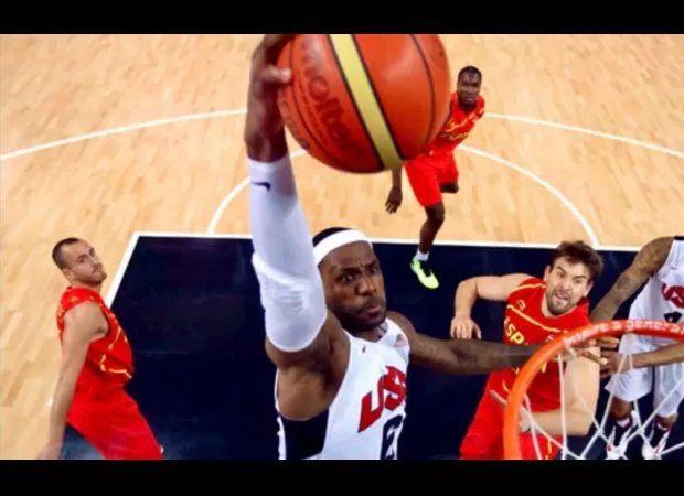 The United States basketball team, led by LeBron James, wins their first game with a flawless dunk from James.