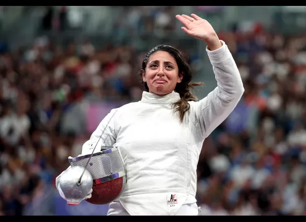 A pregnant fencer shares she won at Paris Olympics.