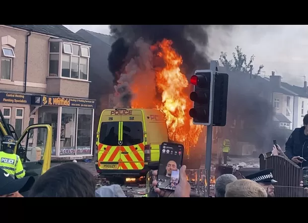 Three girls stabbed to death causing riot in nearby area.