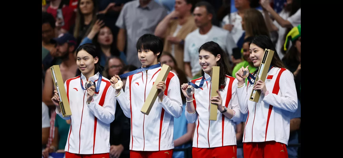 Winners receive a medal during the victory ceremony at the Olympics.