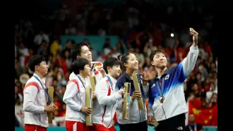 North and South Korean athletes take iconic Olympics selfie.