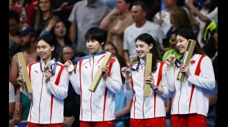 Winners receive a medal during the victory ceremony at the Olympics.
