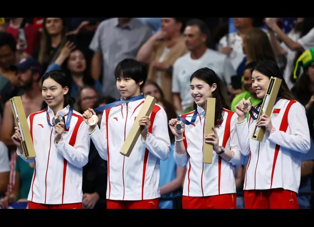 Winners receive a medal during the victory ceremony at the Olympics.