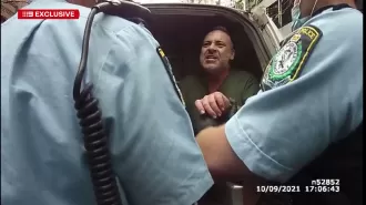 A video from 2021 shows a former TV personality displaying anger during their arrest.