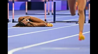 Lina Nielsen, devastated after falling in 400m hurdles at Olympics, receives comfort from reporter.