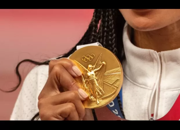 The 2024 Olympic Gold Medal's worth is determined by its metallic content and symbolic significance.
