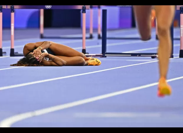 Lina Nielsen, devastated after falling in 400m hurdles at Olympics, receives comfort from reporter.