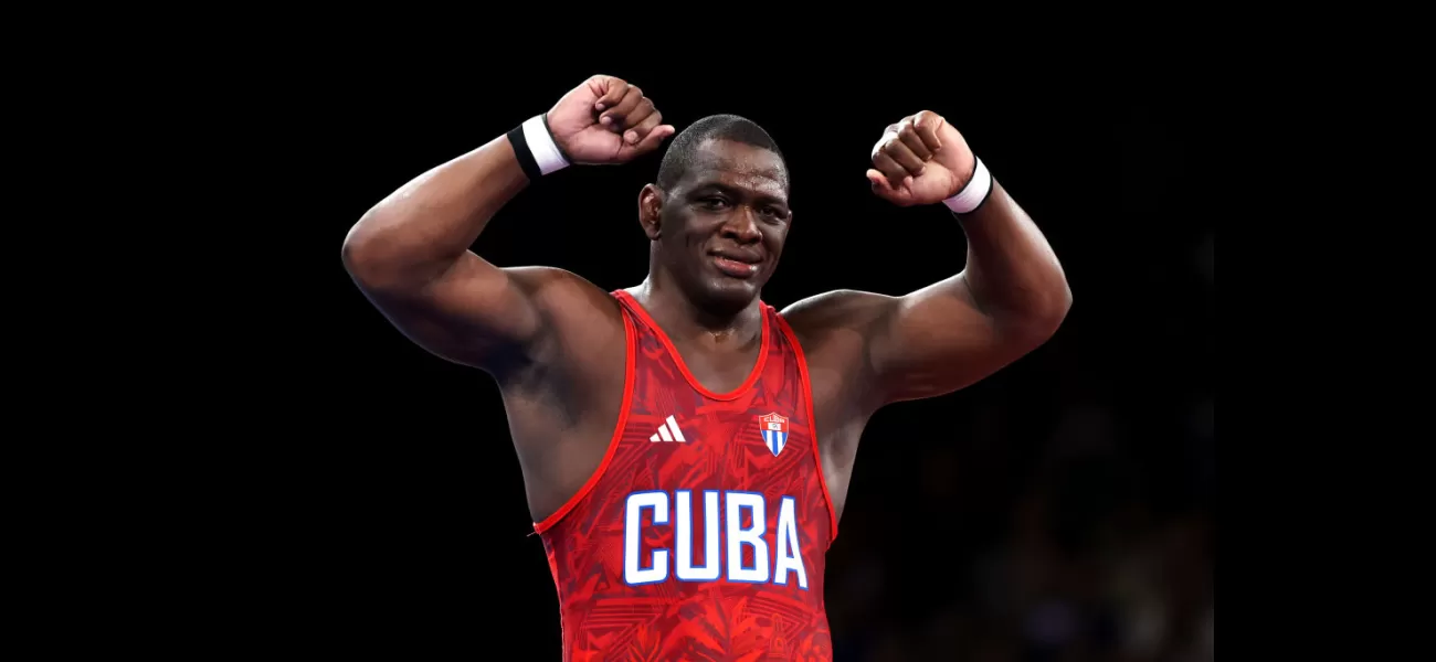 WWE icon congratulates Olympic wrestler on winning record-breaking gold medal.
