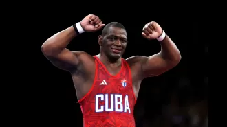 WWE icon congratulates Olympic wrestler on winning record-breaking gold medal.
