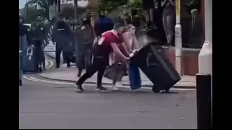 Exciting moment when riot police dispose of garbage thrown at them.