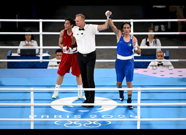 Imane Khelif is ecstatic as she advances to the women's Olympic boxing final, sparking a joyous celebration.