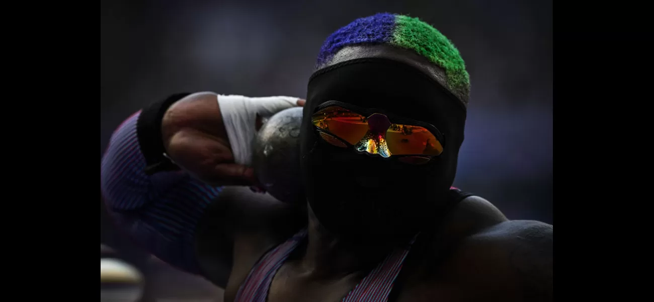Raven Saunders, a USA athlete, is wearing a full face mask and glasses during the Olympics.