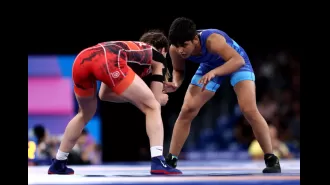 Wrestler sent home for breaking rules at Olympic village.