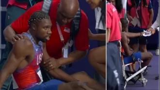 Lyles' positive Covid test announced after leaving Olympic 200m final in wheelchair.