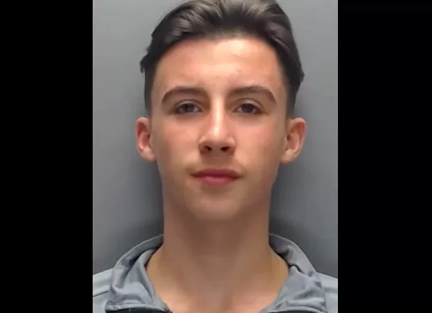 A person arrested for throwing a brick at police claims to be a child.