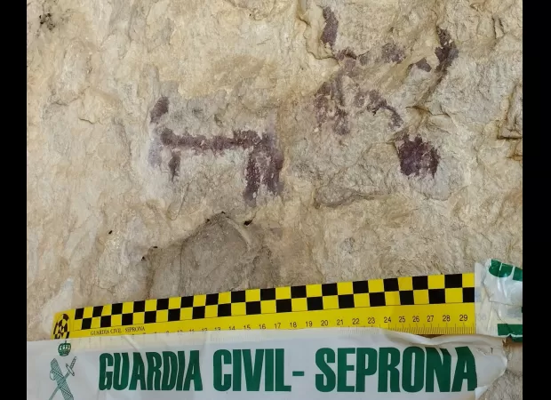 Man accused of splashing water on ancient cave art to improve photographs.