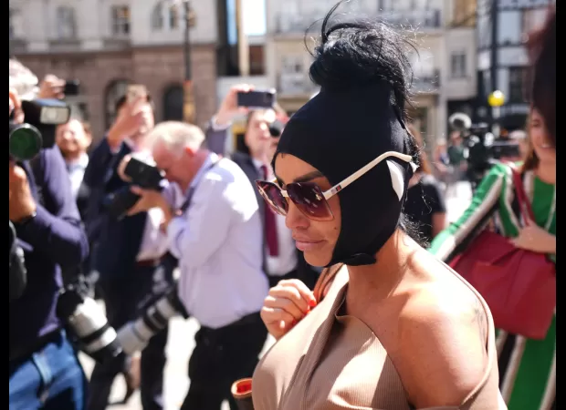 Katie Price shows up to court with post-surgery scars following Heathrow airport detainment.