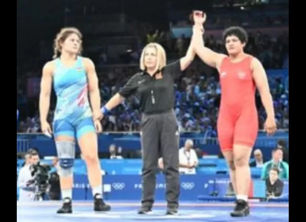 Reetika Hooda advances to quarterfinals in the 76kg weight class at Paris Olympics.