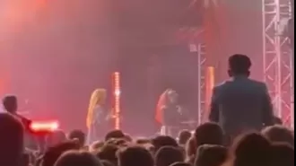 Sugababes interrupt performance to request security.