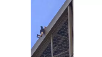 Man detained for scaling Eiffel Tower days before Olympics finale.