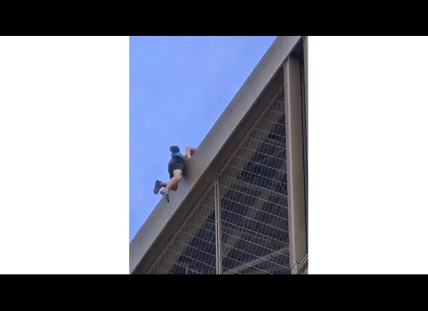 Man detained for scaling Eiffel Tower days before Olympics finale.