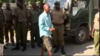 The leader of a group that caused hundreds of deaths through starvation is on trial.