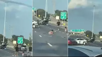 Video shows young children in diapers walking on road after car accident in America.