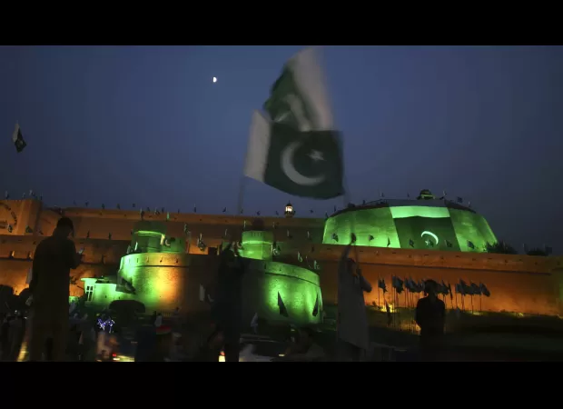 Three people died when a store selling Pakistani flags was targeted by grenade attacks.