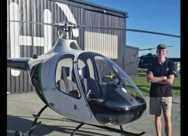 A pilot who later crashed his helicopter into a luxury hotel in Cairns was previously celebrating a promotion.