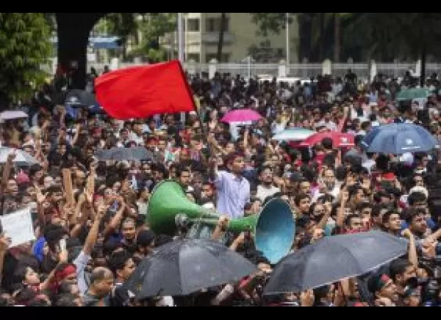 Bangladeshi students in charge of roads as traffic police resume work.