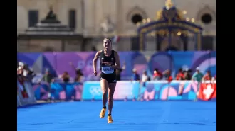 British Olympic athlete finished marathon with fractured leg, tough downhill sections caused extreme pain.