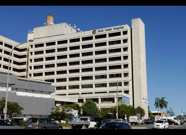 Gold Coast woman undergoes long wait for knife extraction due to emergency room backlog.