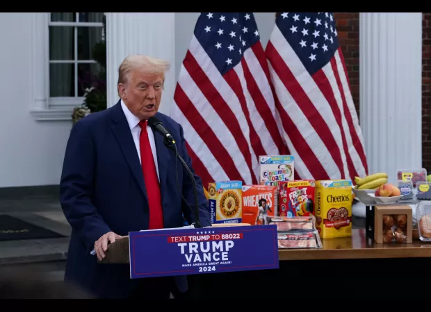 Trump accuses Harris as he stands next to sweet morning meals.