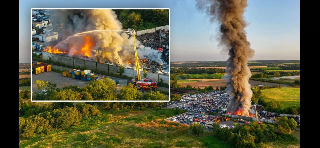 Massive blaze transforms junkyard into raging fire visible for miles.