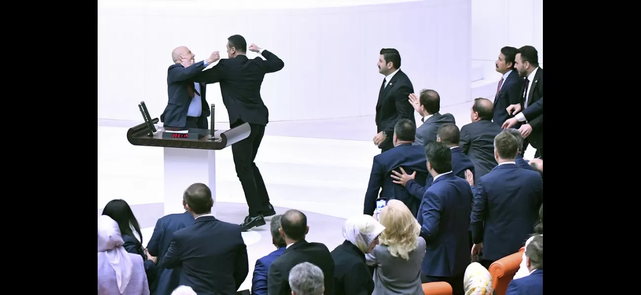Turkish politicians physically fight over incarcerated colleague during parliamentary session.