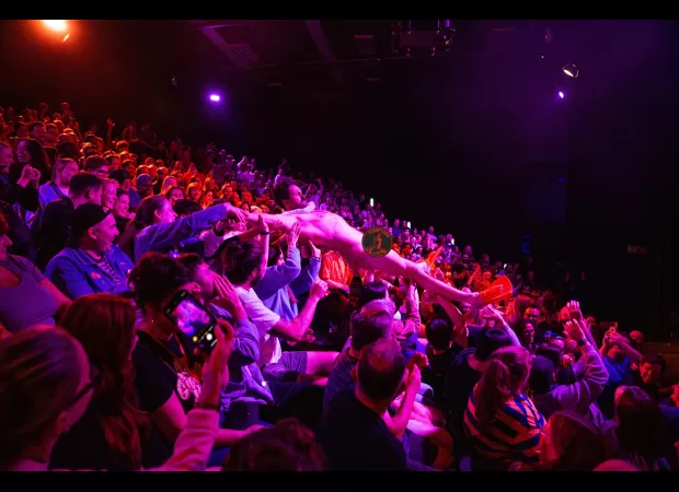 Comedian crowd surfs naked in wildest Edinburgh Fringe show ever.