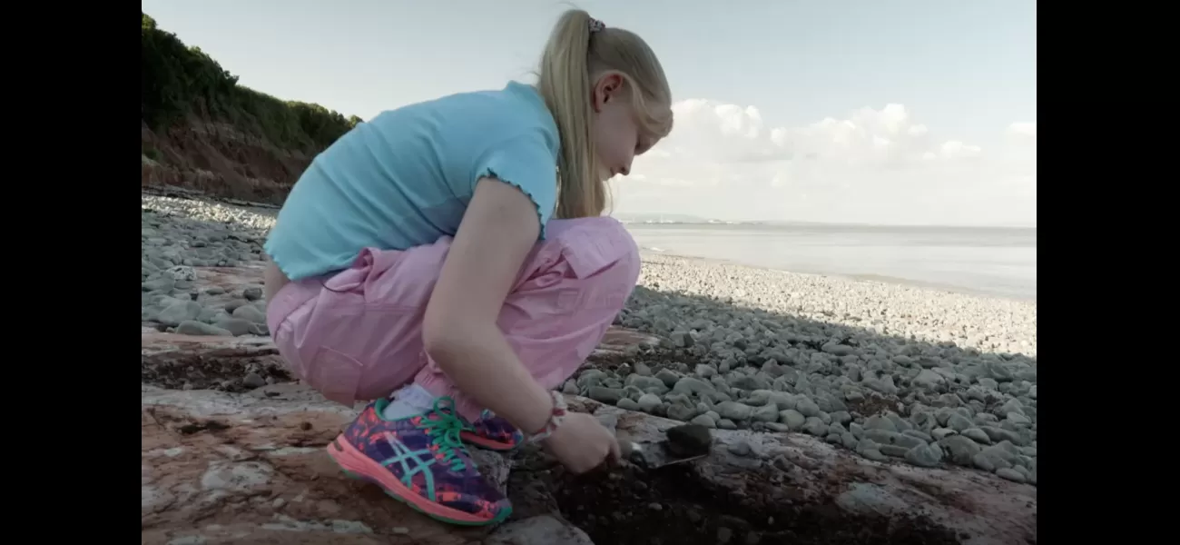 A girl discovered dinosaur footprints while taking a stroll on the beach.