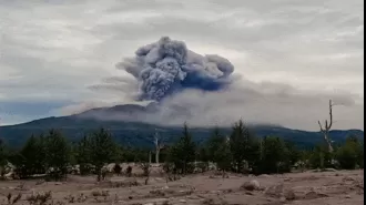 A volcano erupts in Russia's Far East following a powerful earthquake, with experts predicting a potentially stronger one.