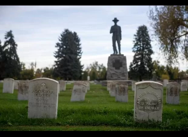 Police arrested a man on suspicion of murder after he allegedly shot someone at Crown Hill Cemetery at night.