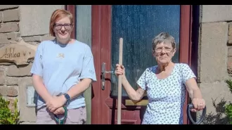 An elderly woman, 75, fixes potholes outside her home on her own initiative.
