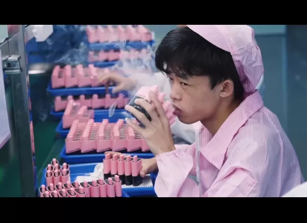 Worker in factory tests thousands of vapes daily on camera.