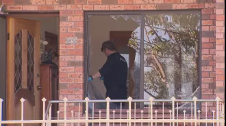 Family fleeing to safety before man assaulted their home in Sydney.
