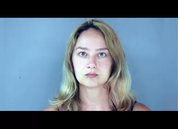 Woman attempts to hit boyfriend while heading to therapy to end relationship.